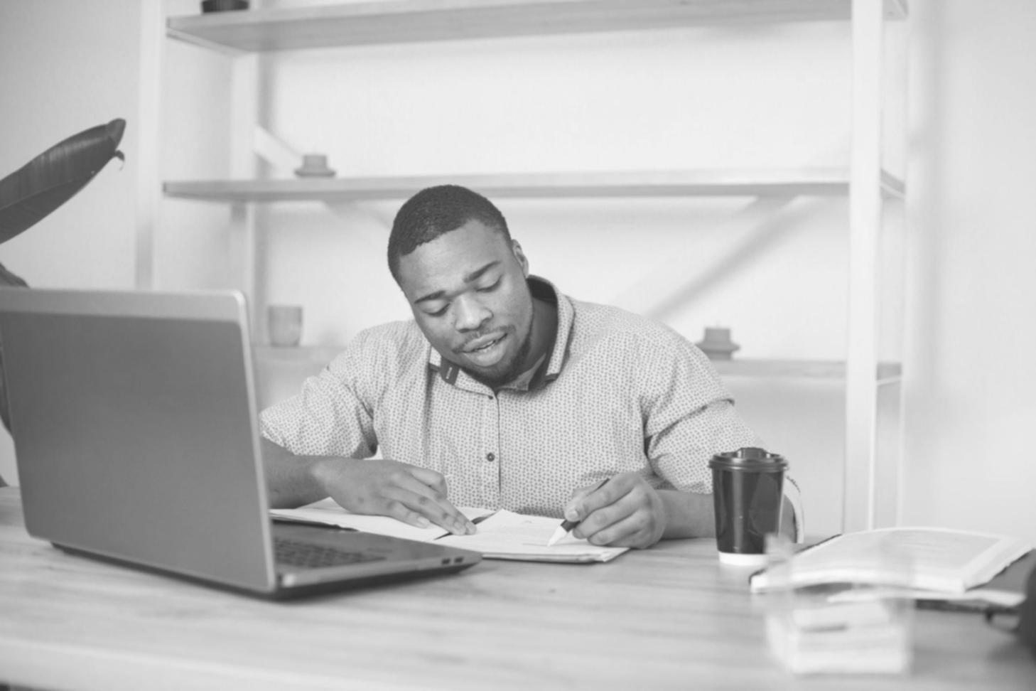 Calculator and financial spreadsheets on office table