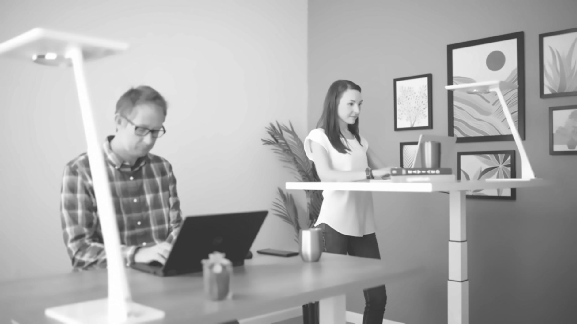 Business owner reviewing budget documents at desk